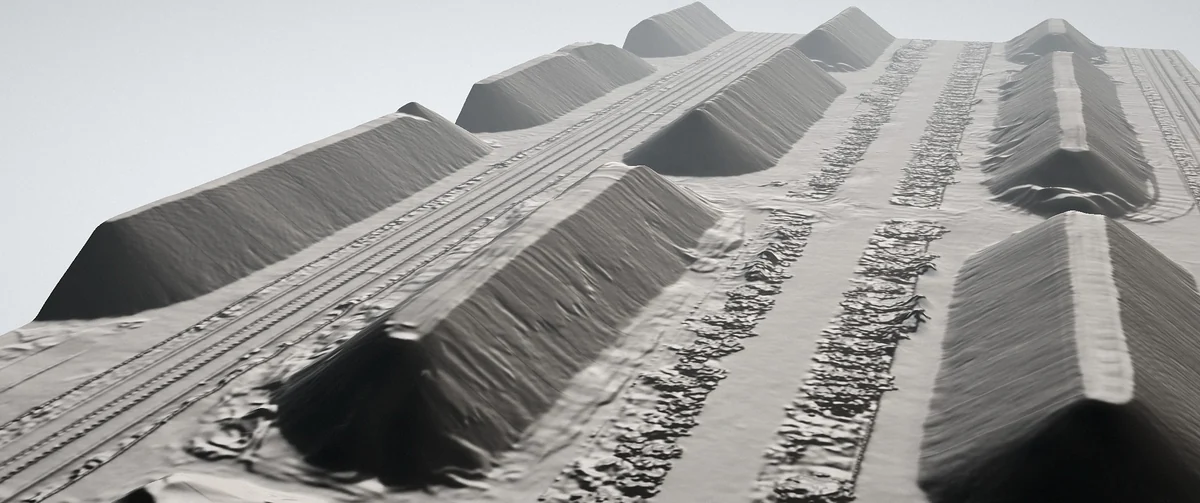 Oblique neutral surface model of an entire stockyard and its piles